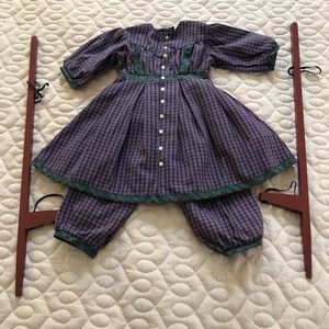 Addy’s purple plaid outfit and stilts